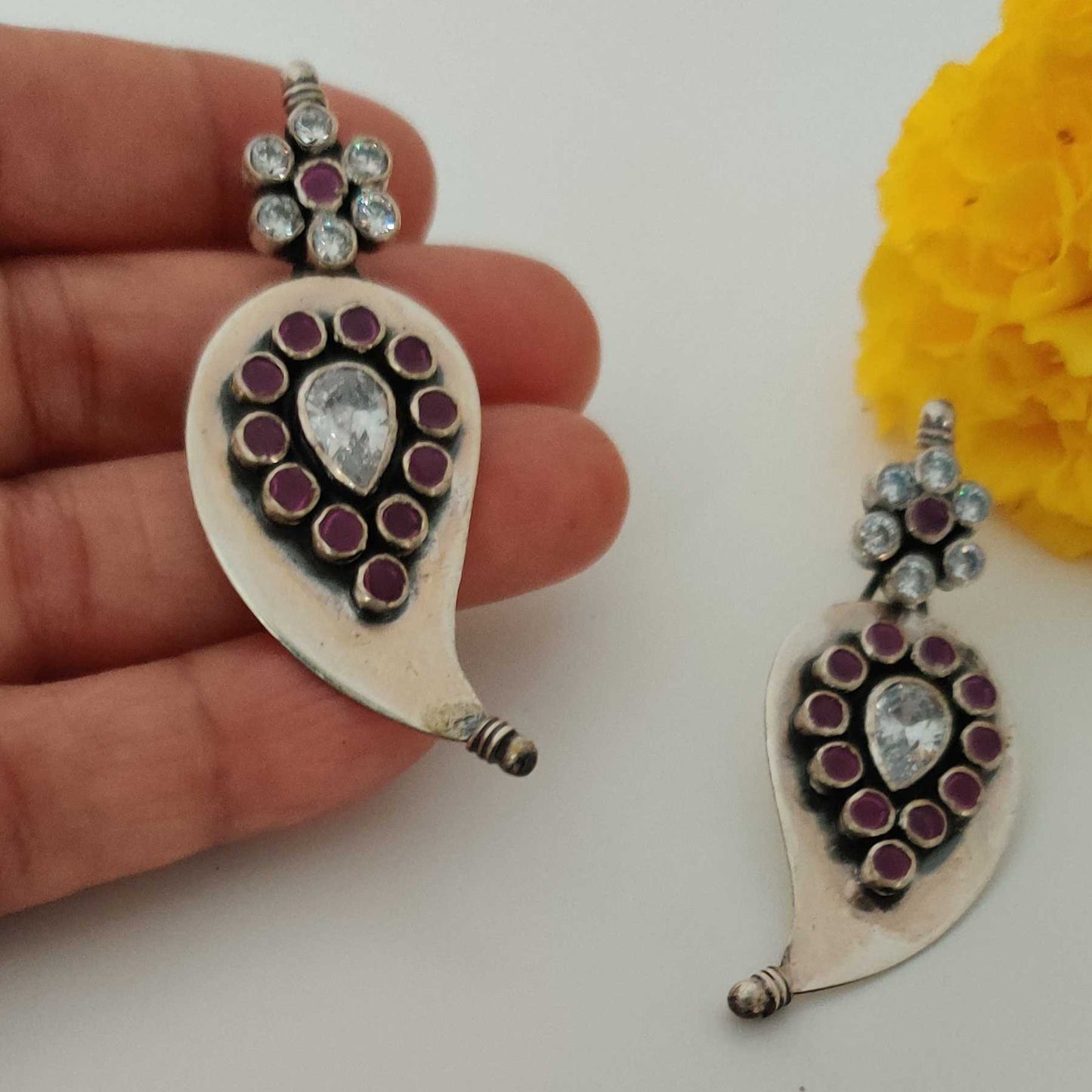 Silver Cutstone Ruby encircled White Earring
