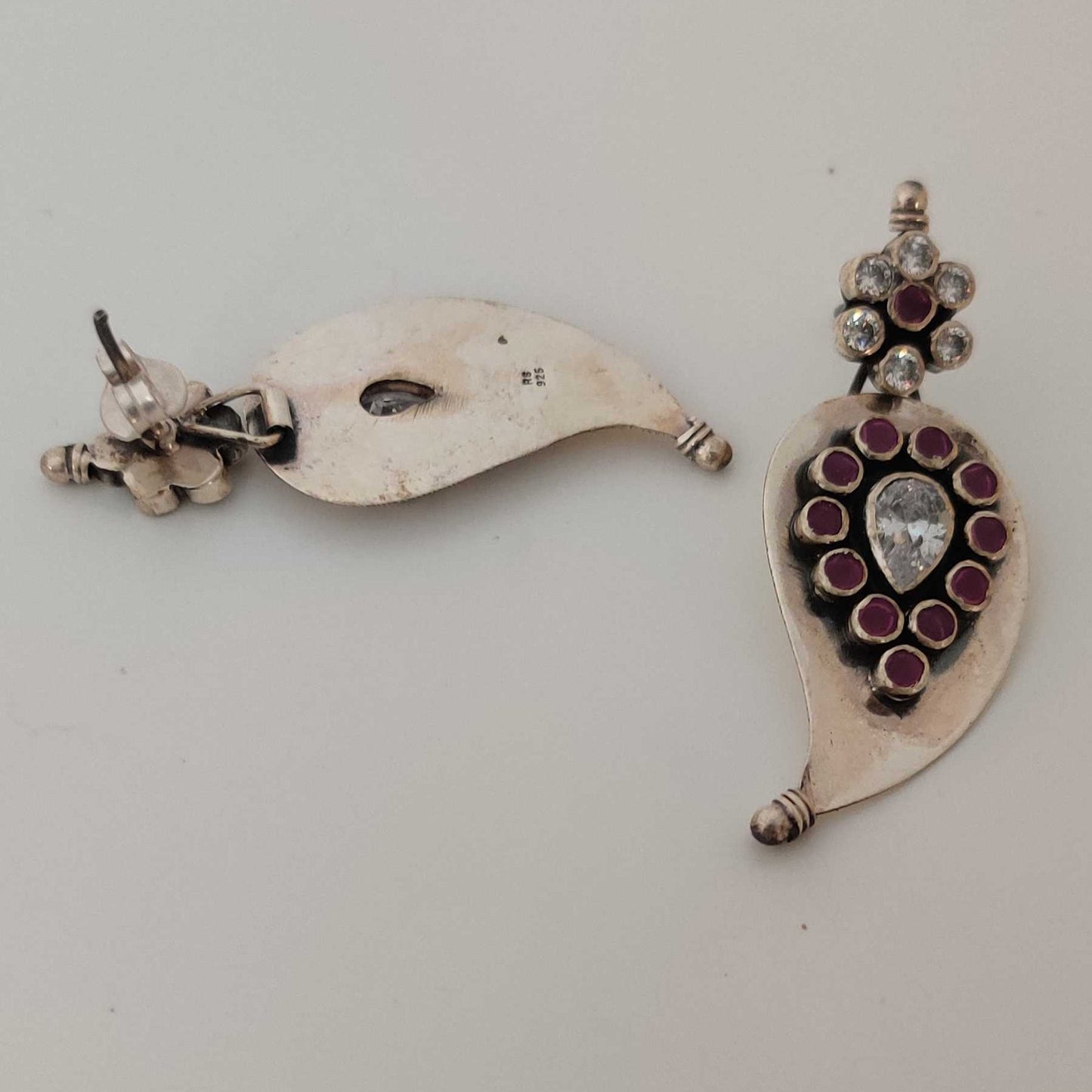Silver Cutstone Ruby encircled White Earring